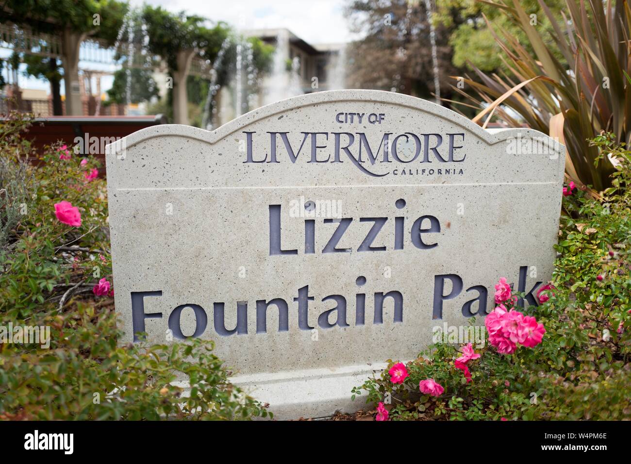 Sign among flowers at Lizzie Fountain Park, a public park in downtown Livermore, California, October 3, 2018. () Stock Photo
