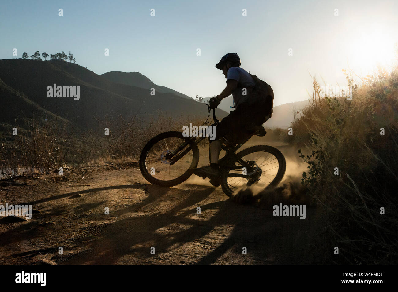 Mature Man riding mountain bike on trail in San Diego, California Stock Photo