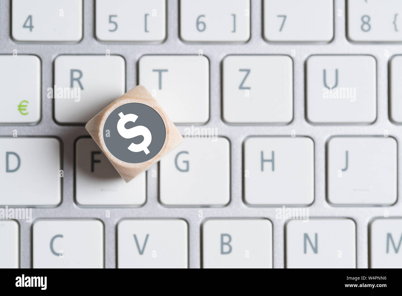 Cube With A Dollar Symbol On Top And A Computer Keyboard Stock Photo Alamy