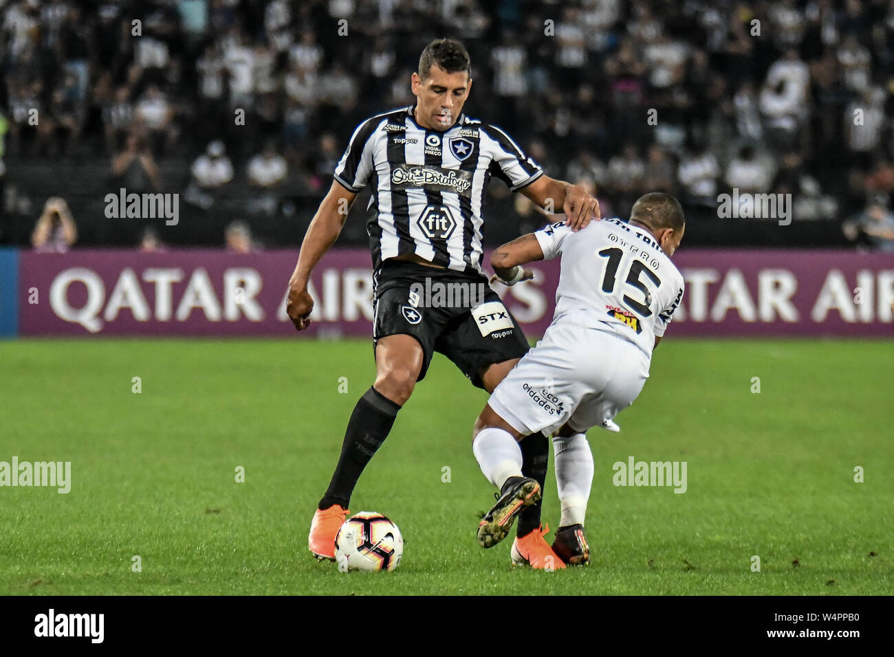 Rio De Janeiro, Brazil. 24th July, 2019. Diego Souza plays the ball with Otero during Botafogo vs Atletico MG, a match valid for the Copa Sudamericana, held at the Nilton Santos stadium, located in the city of Rio de Janeiro, on Wednesday (24). Credit: Nayra Halm/FotoArena/Alamy Live News Stock Photo