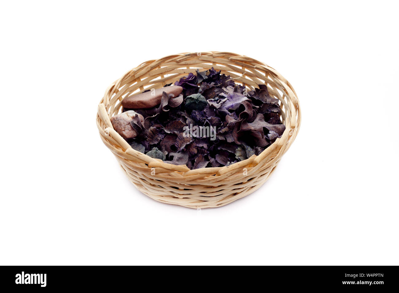 Dried flowers in a wicker basket on white Stock Photo