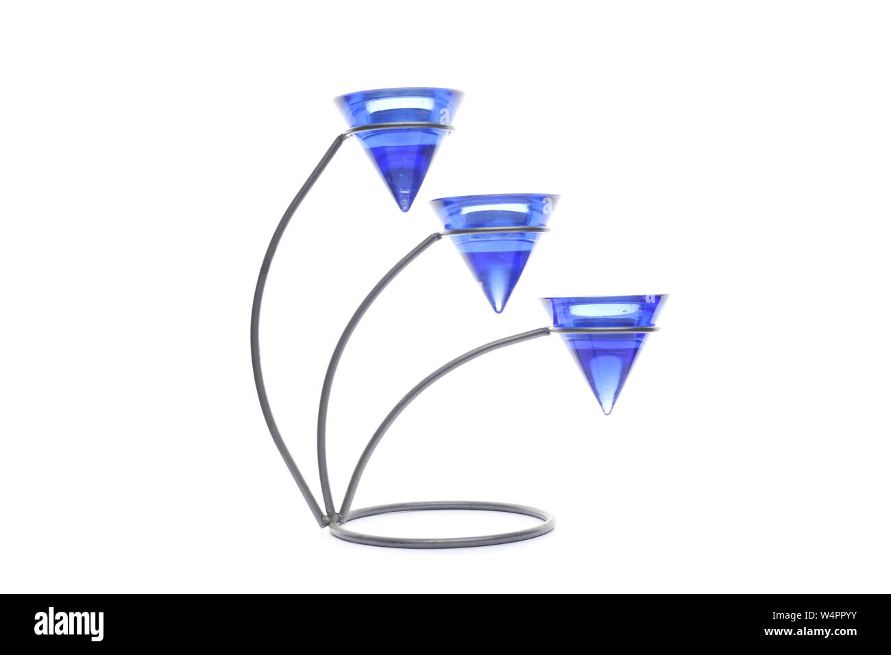 three modern black candlesticks with candles isolated on white