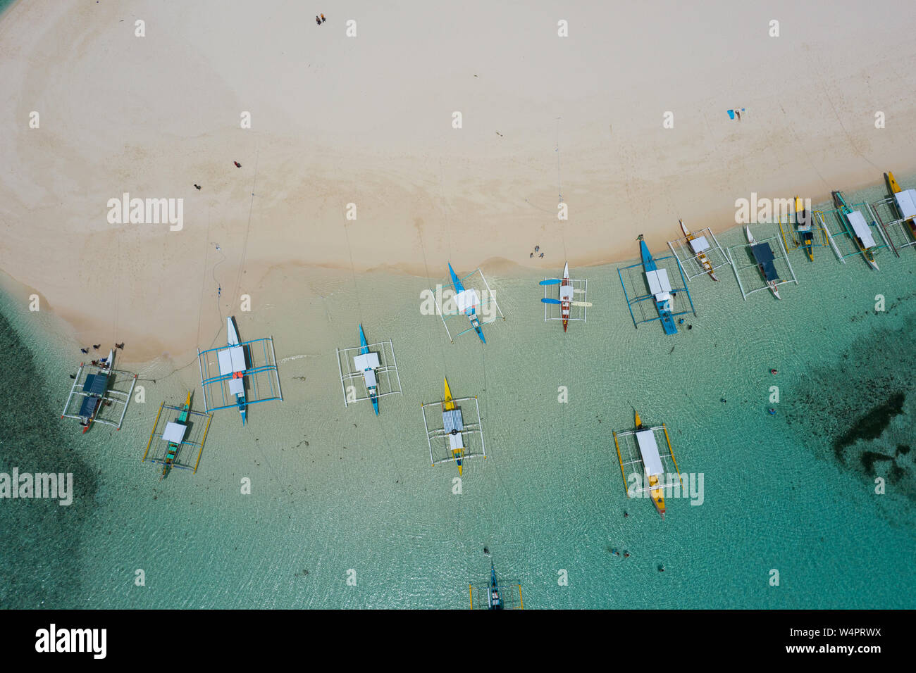 Aerial overhead view of outrigger boats moored at Daku Island,Siargao,Philippines. Stock Photo