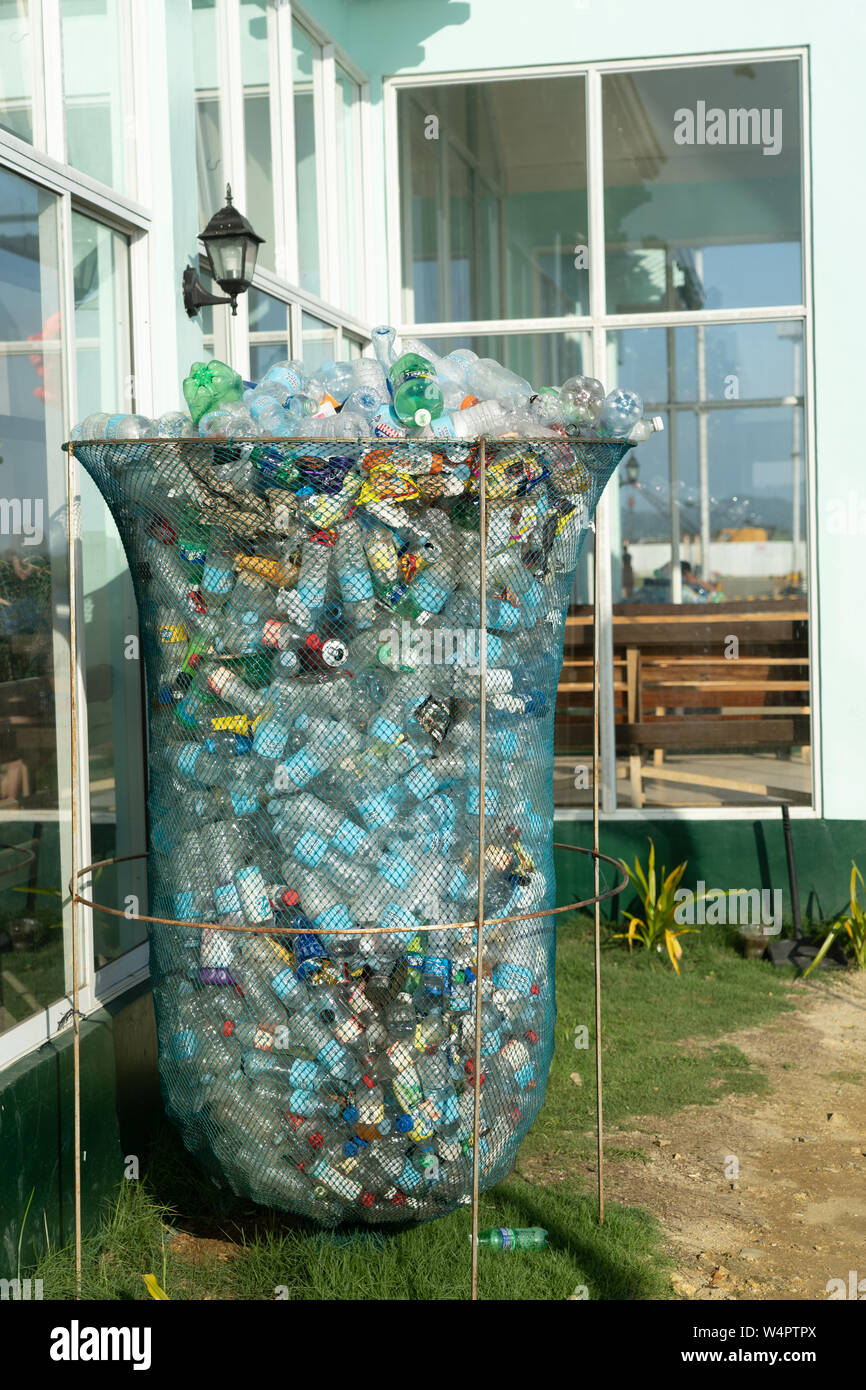 An overflowing bin of collected plastic bottles,Siargao island