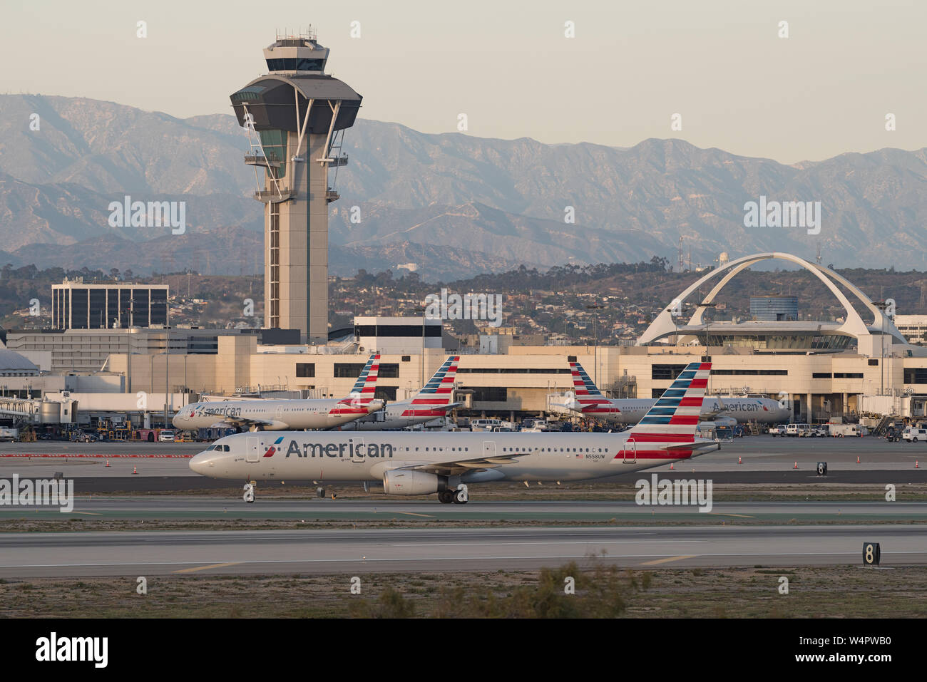 Image showing four American Airlines jets at the Los Angeles International Airport . Stock Photo
