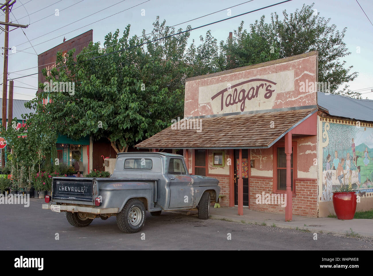 Old Chevrolet pickup parked in front of a restaurant on historic Murphy Street, in Alpine, Texas. Stock Photo