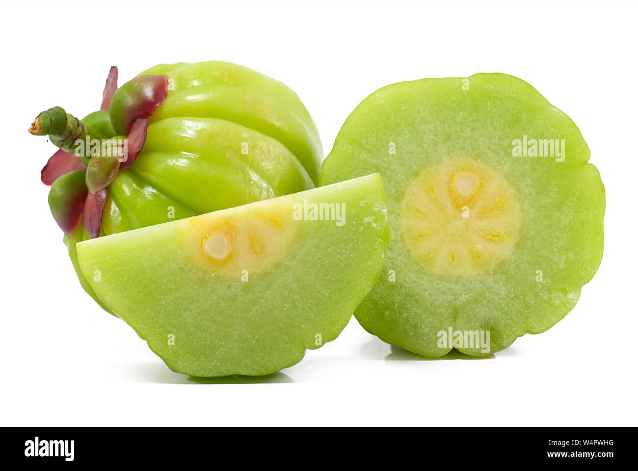 Garcinia atroviridis fruit isolated on white background Stock Photo