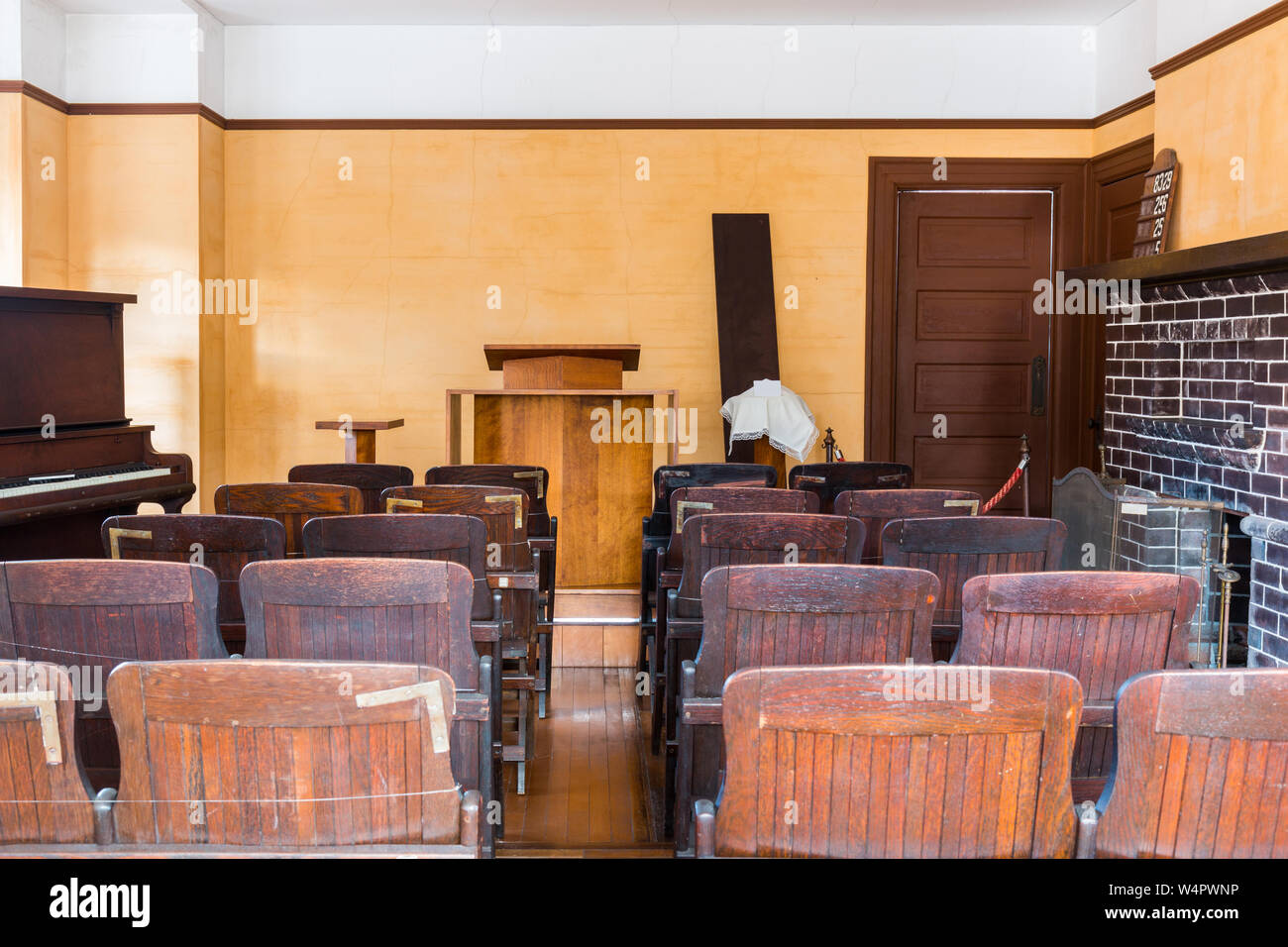 A empty witness chair inside a classic American courtroom. Stock Photo