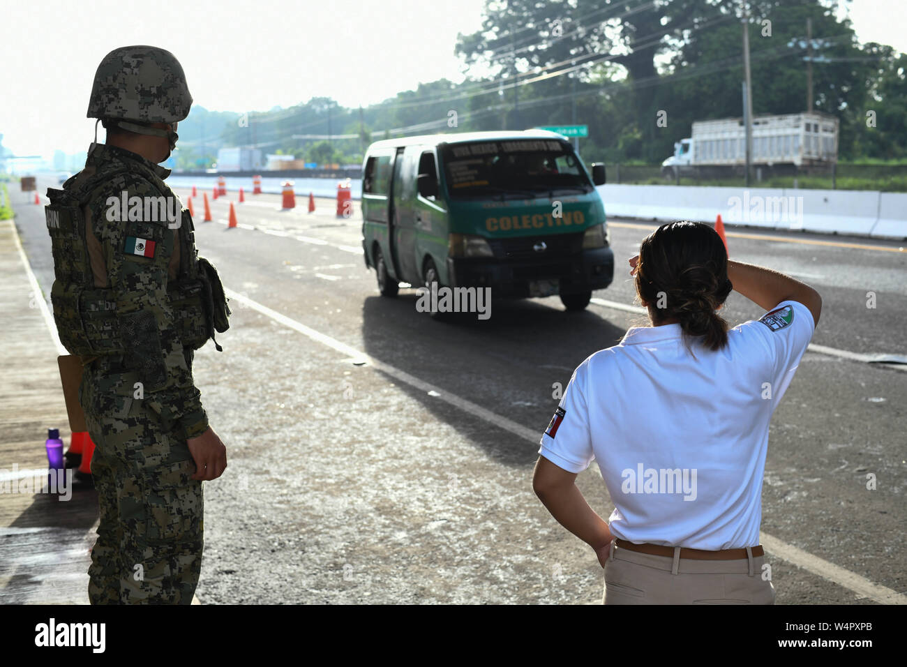 July 24, 2019, Tapachula, Chiapas, Mexico: Mexican marines and immigration officers check IDs of commuters arriving into Tapachula city on Wednesday. Hundreds of illegal arrivals still happen every day as the flow of migrants has moved to isolated spots along the Suchiate River, which marks the border between the two nations. Mexican President Lopez Obrador's administration claims to have reduced the flow of migrants looking to reach America, but much of the flow continues in remote border areas. Credit: Miguel Juarez Lugo/ZUMA Wire/Alamy Live News Stock Photo