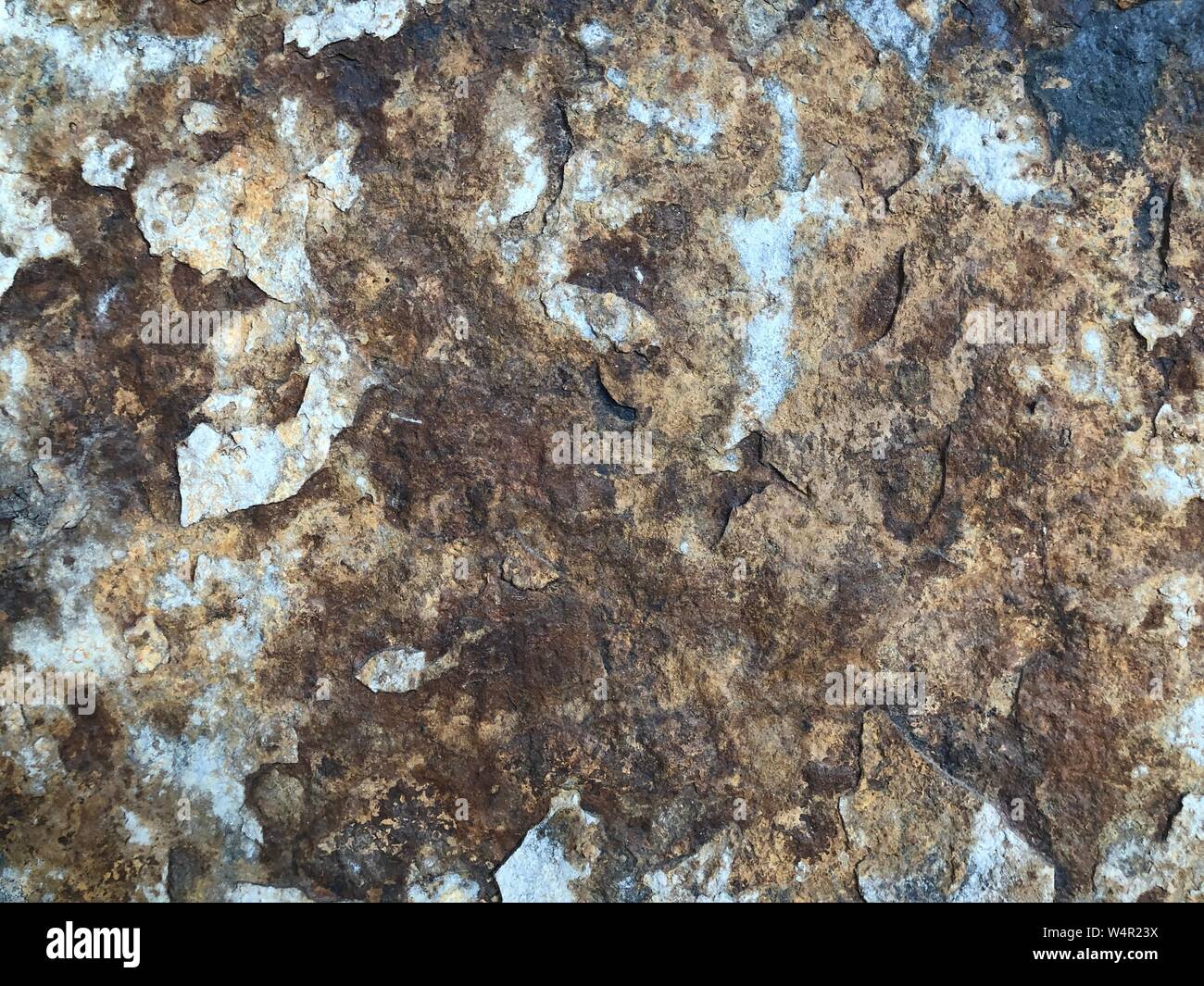 Old rock wall background and sandstone texture in old weathered grunge design Stock Photo