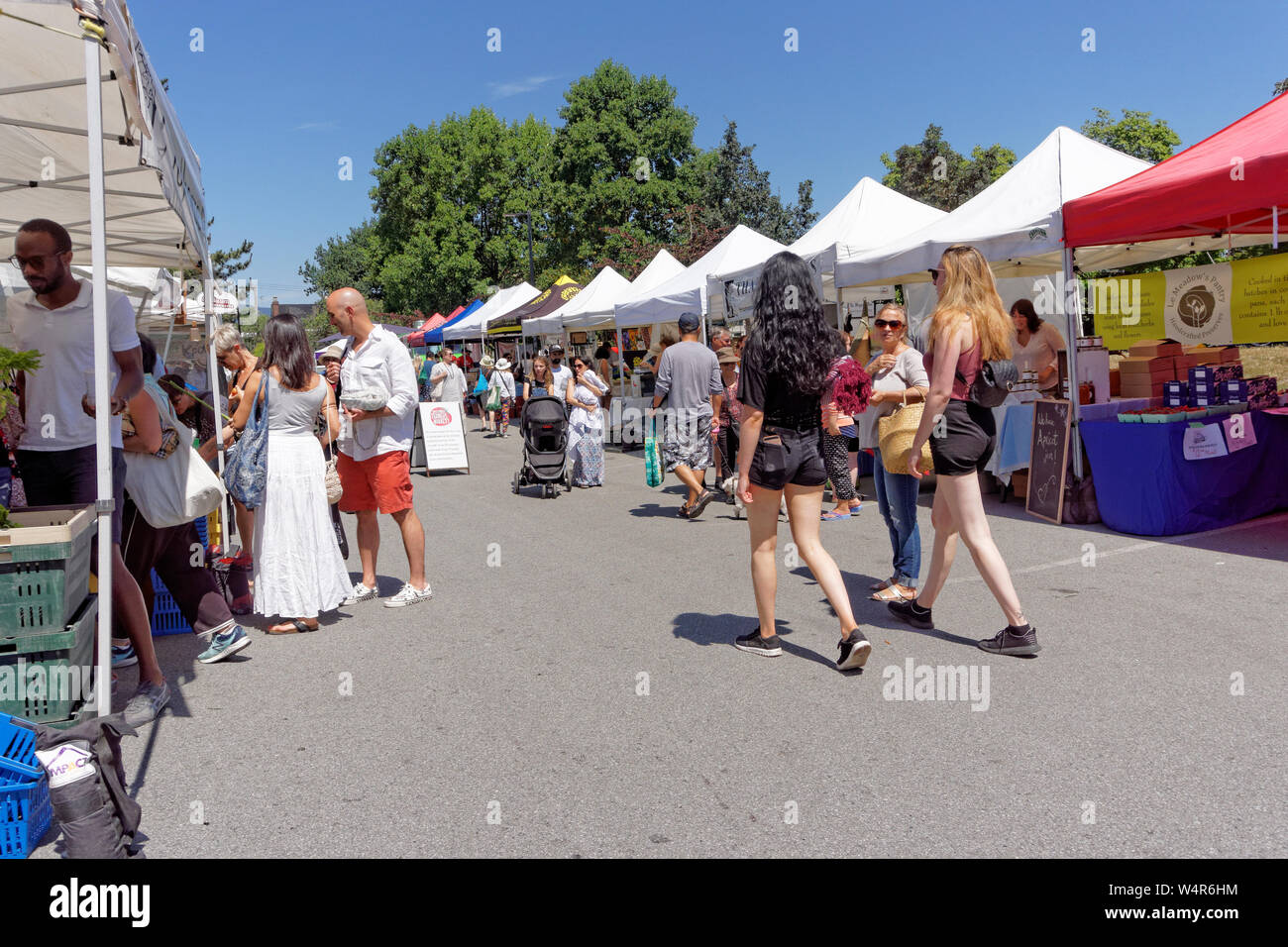 People shopping at an outdoor farmers market in Kitsilano,Vancouver, BC