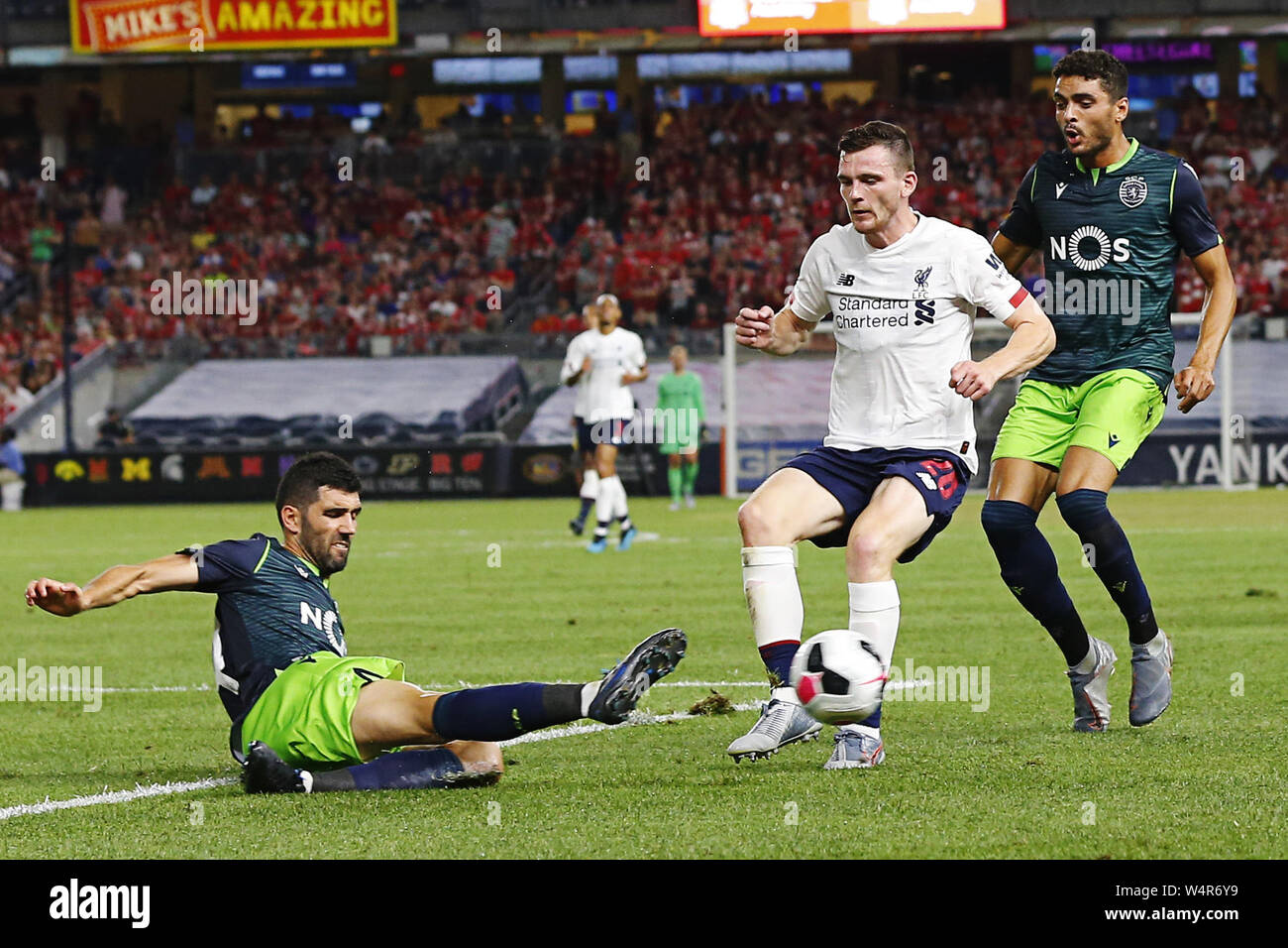 New York, USA. 24th July, 2019. LUIS NETO (14) of Sporting CP battles for the ball against ANDY ROBERTSON (26) of Liverpool FC during first half of the soccer match at Yankee Stadium in Bronx, New York. Credit: Anna Sergeeva/ZUMA Wire/Alamy Live News Stock Photo