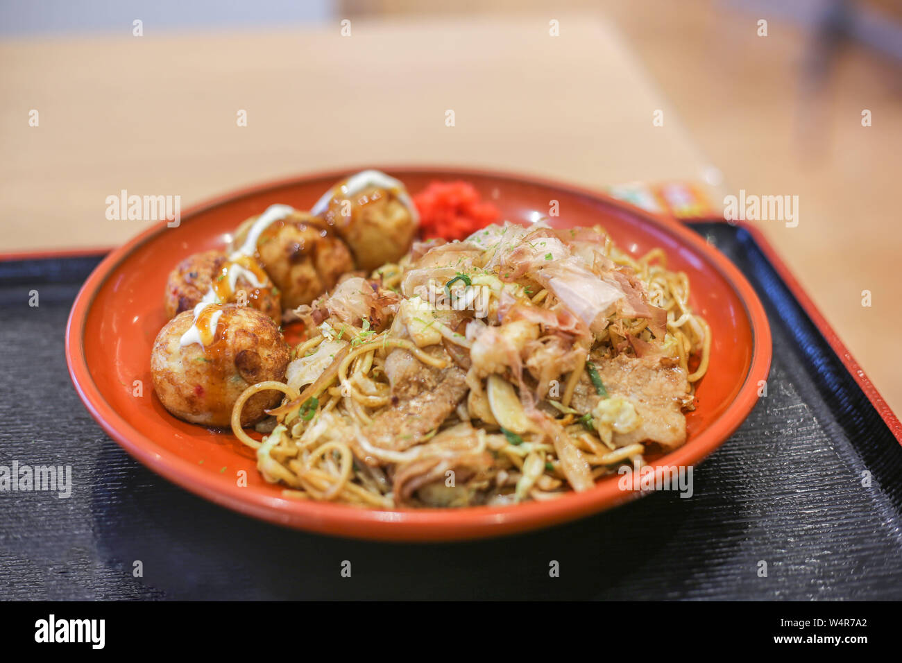 takoyaki and yakisoba in a plate in a food court Stock Photo