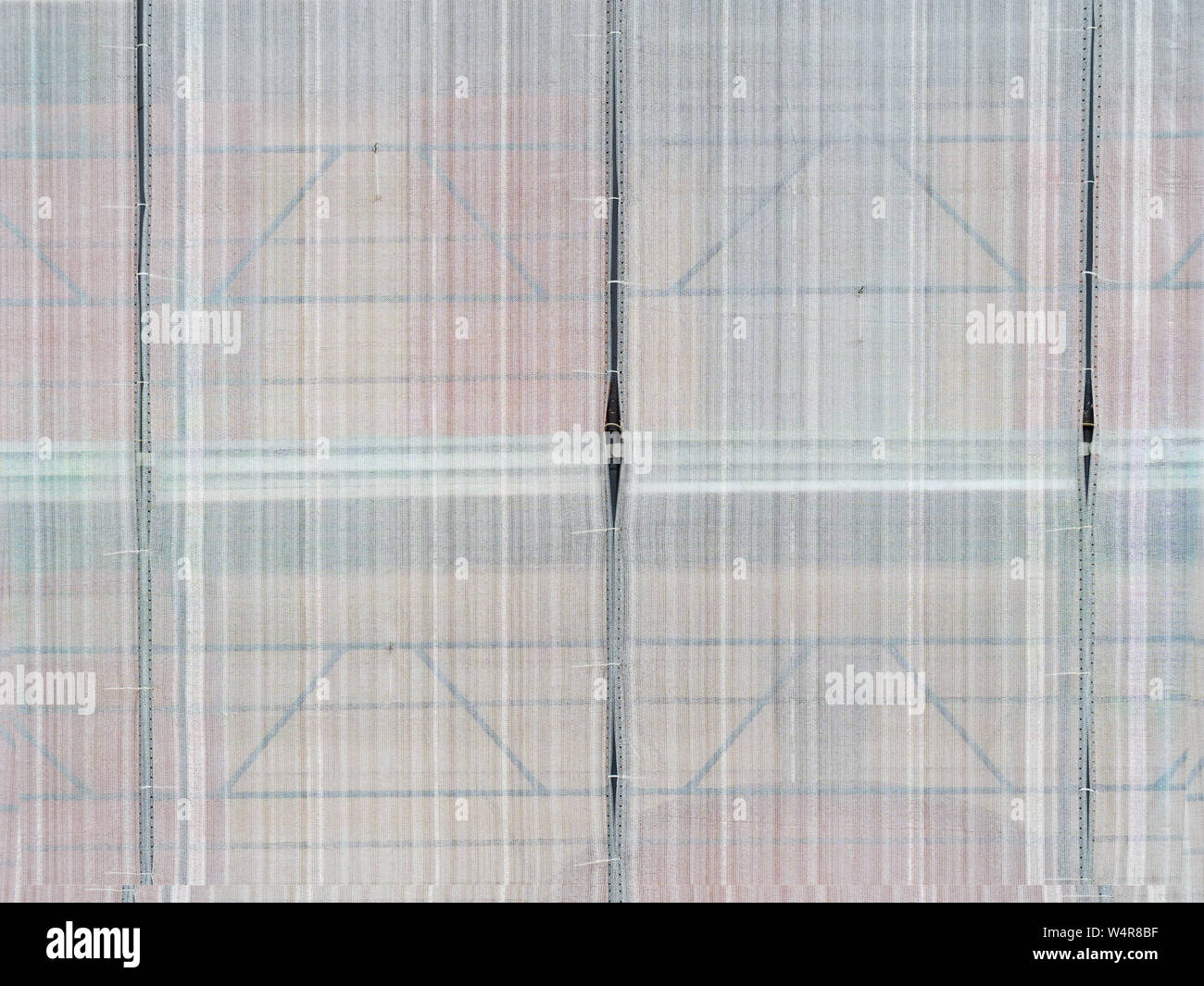 Scaffolding covers, nets, building site background. Under construction. Stock Photo