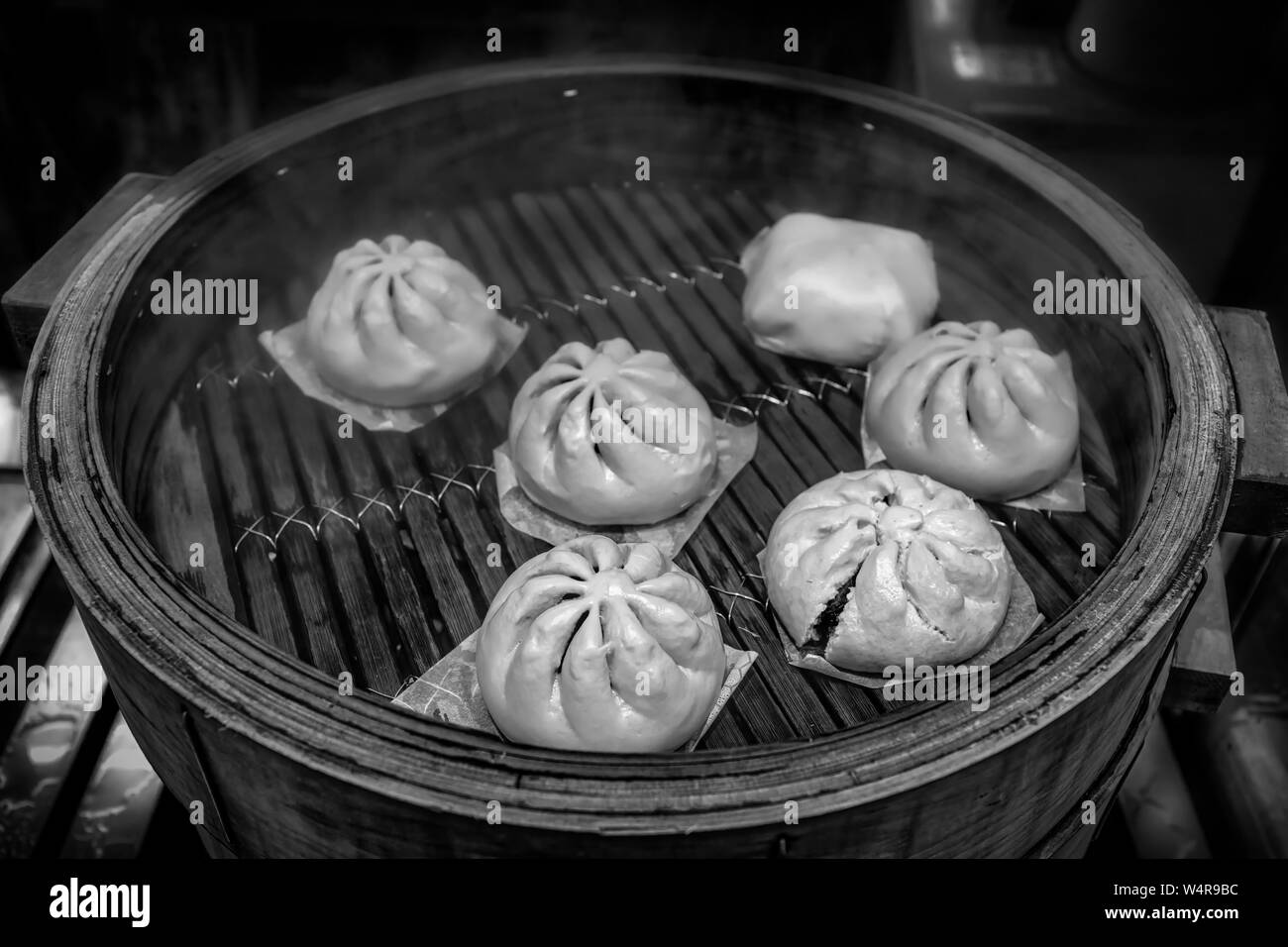 Asian dumplings, called dimsum, cooking in a wooden steamer in Yokohama's Chinatown near Tokyo. Stock Photo