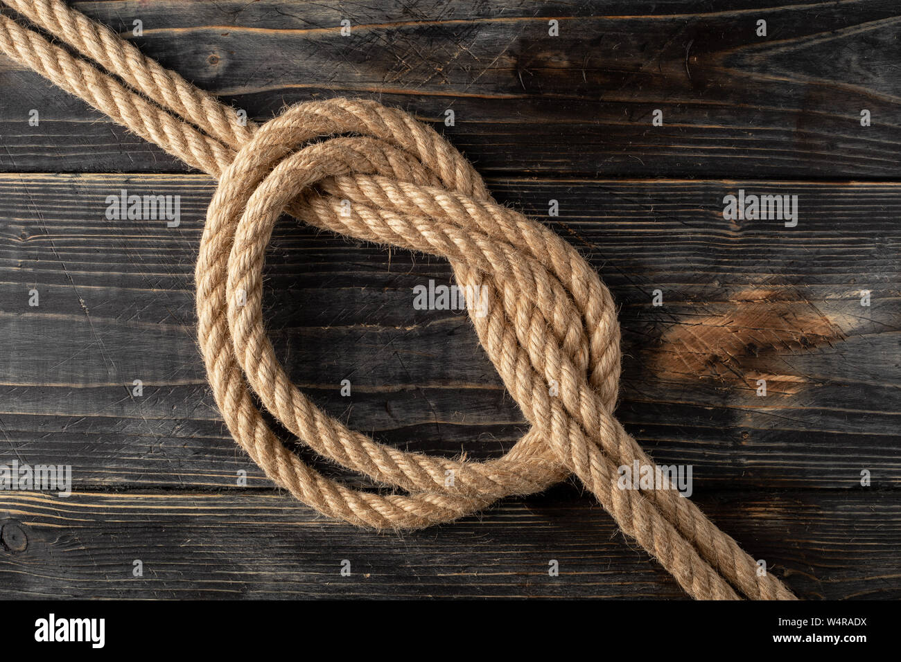 Overhand Bow Knot. Rope node Stock Photo