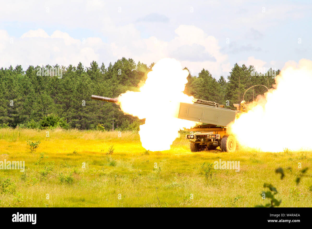 Soldiers from the Alpha Battery, 1-182 Field Artillery fires their High Mobility Artillery Rocket system during Northern Strike 2019 at Camp Grayling, Michigan, July 23, 2019. Northern Strike 19 is a National Guard Bureau-sponsored exercise uniting service members from more than 20 states, multiple service branches and numerous coalition countries. The exercise demonstrates the Michigan National Guard’s ability to provide accessible, readiness-building opportunities to achieve and sustain proficiency in conducting mission command, air, sea, and ground maneuver integration, with the synchroniza Stock Photo