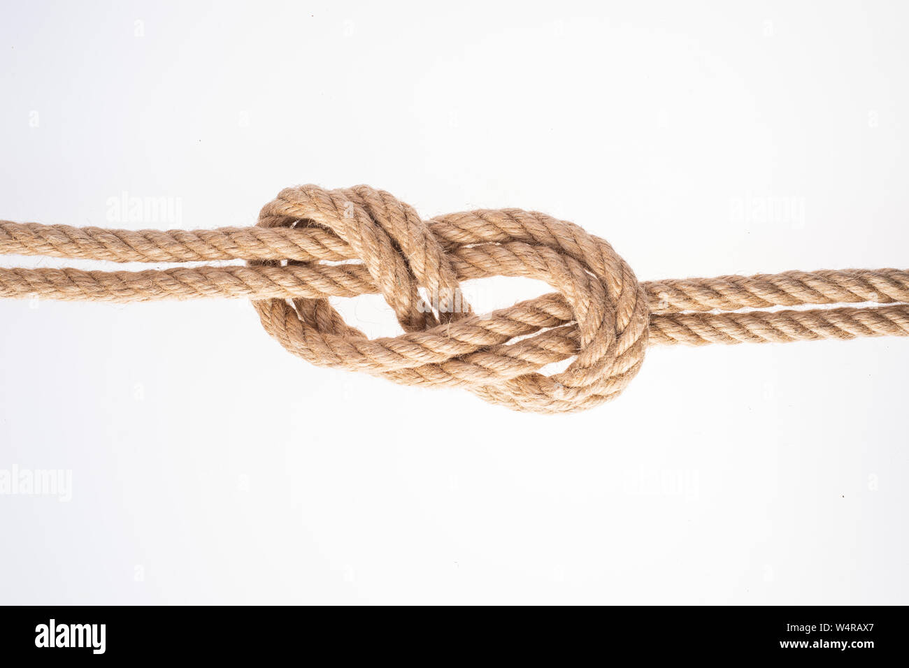 Double Figure Eight knot on white background. Rope node Stock Photo - Alamy