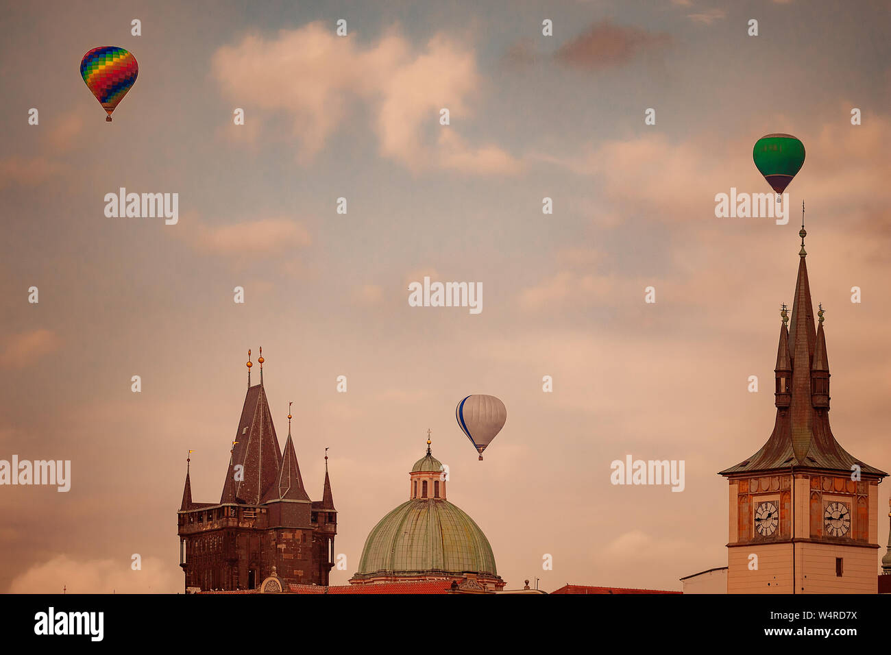 Balloons over Prague roofs and towers Stock Photo