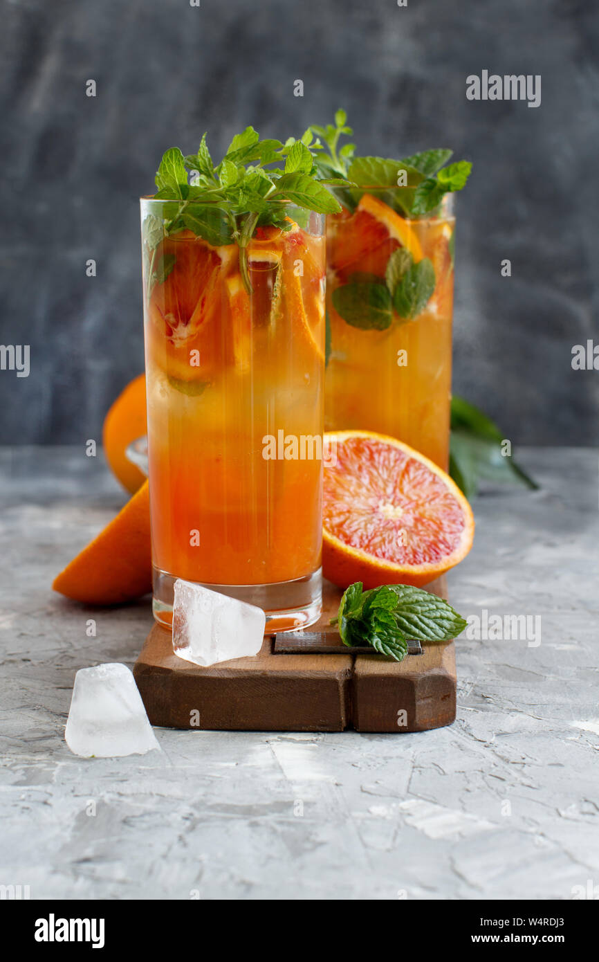 Homemade refreshing drink with bloody orange juice and mint close up Stock Photo