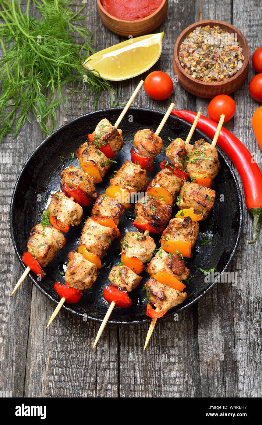 Appetizer chicken kebab with vegetables, top view Stock Photo