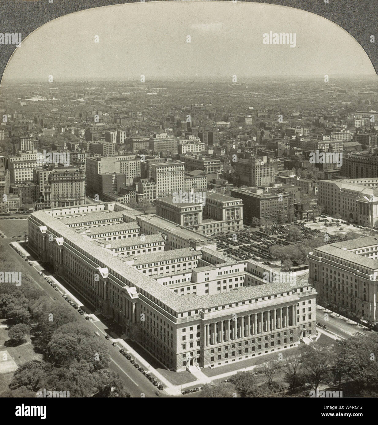 Herbert C. Hoover Building (The Commerce Building) from Washington Monument in 1935. The Herbert C. Hoover Building is the Washington, D.C. headquarters of the United States Department of Commerce. The building is located at 1401 Constitution Avenue, Northwest, Washington, D.C., on the block bounded by Constitution Avenue NW to the south, Pennsylvania Avenue NW to the north, 15th Street NW to the west, and 14th Street NW to the east. Stock Photo