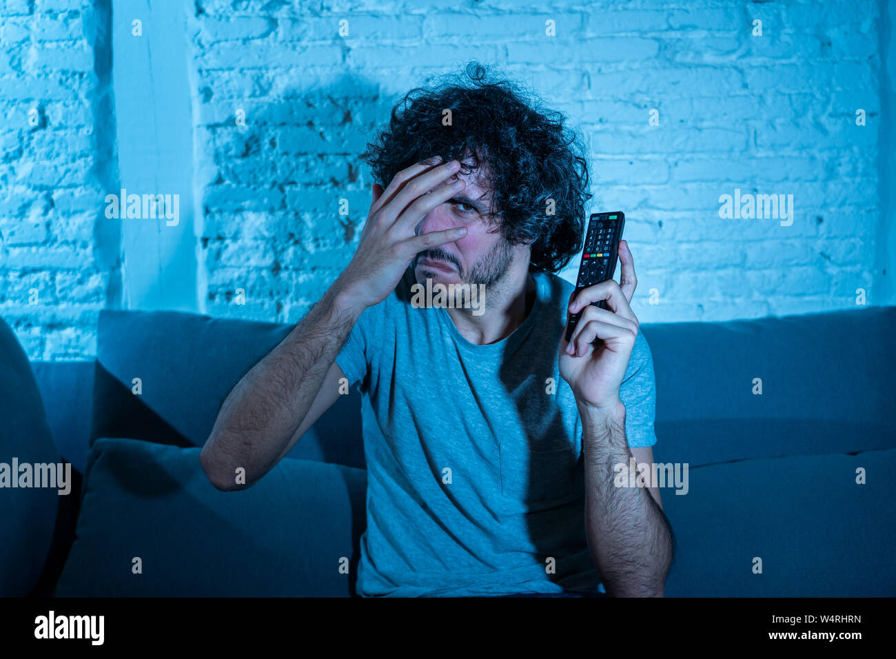 Lifestyle portrait of young man feeling scared and shocked making fear