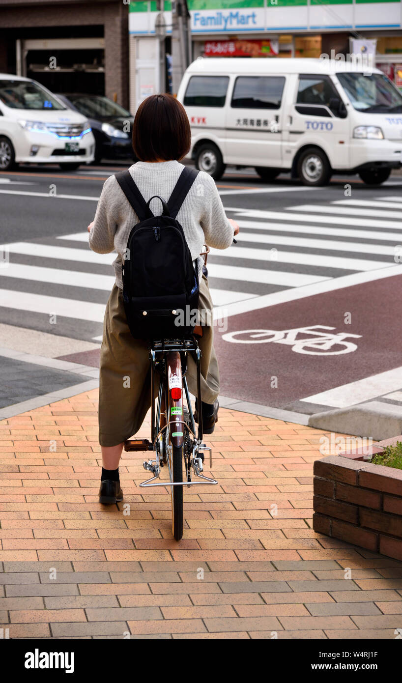 girl on bicycle Japan Stock Photo Alamy