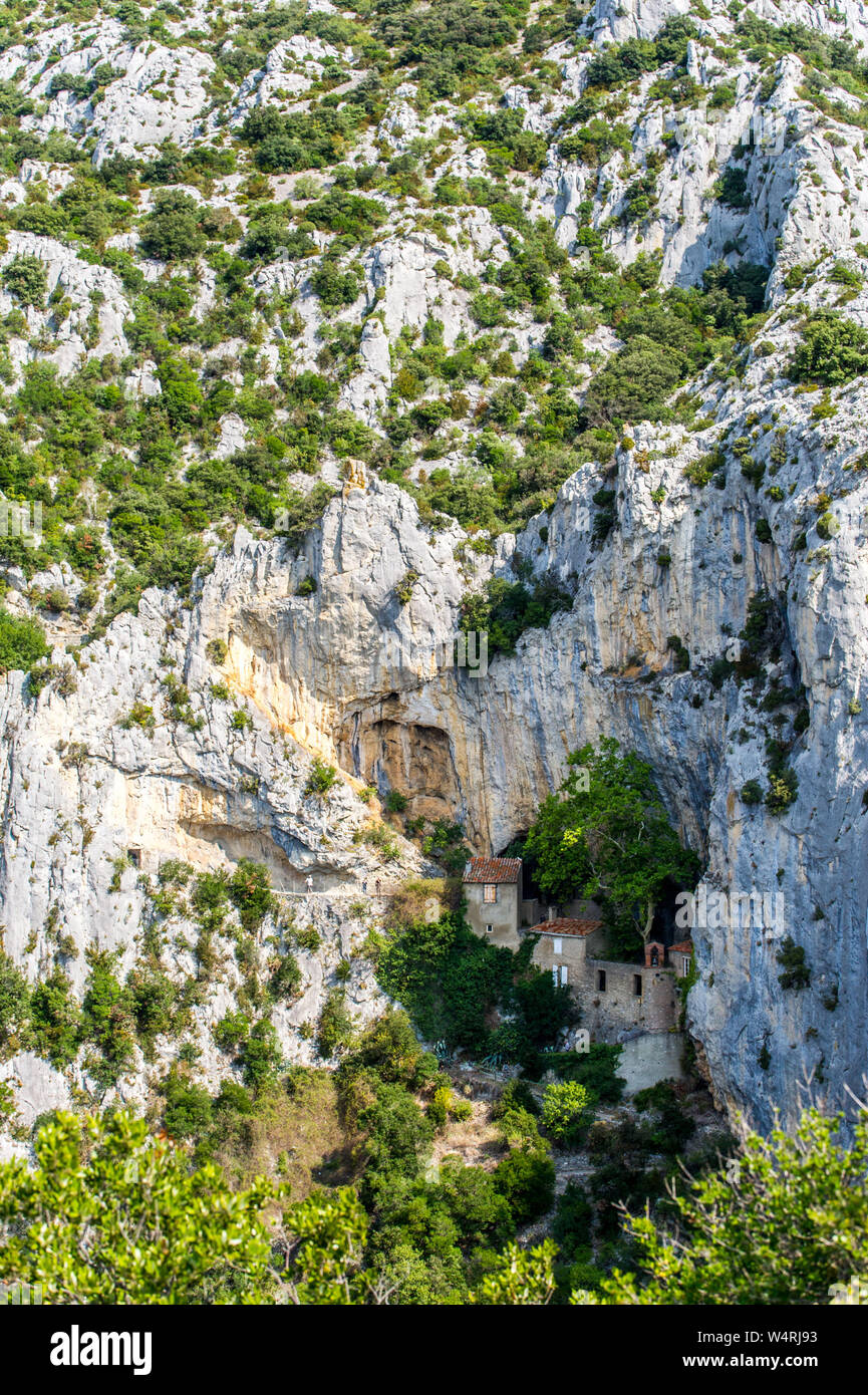 Troglodyte hermitage of Saint-Antoine in the Galamus Gorges near Saint-Paul-de-Fenouillet (south of France), between the “Pays Catalan” and “Pays Cath Stock Photo