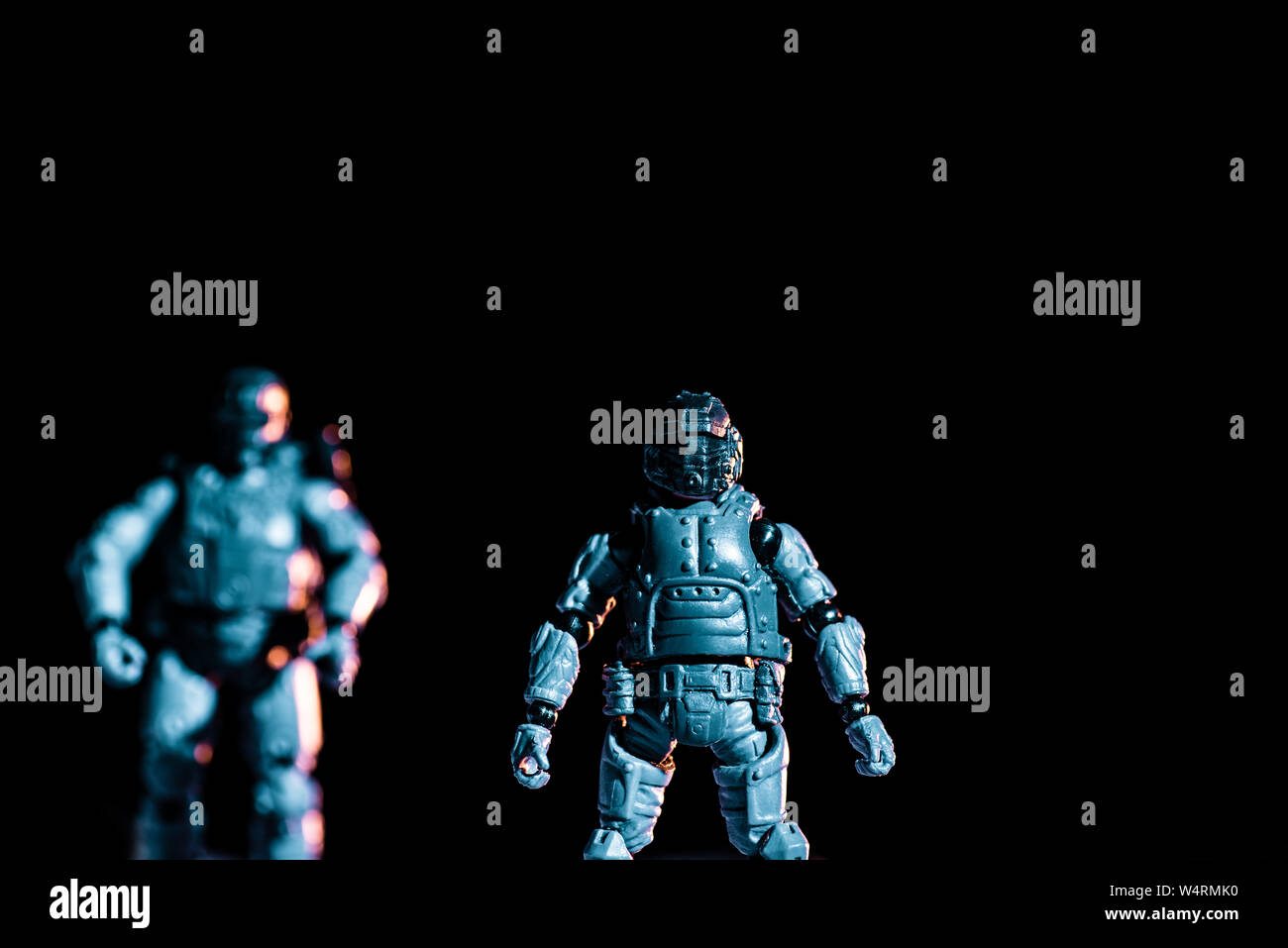 selective focus of toy plastic soldiers isolated on black Stock Photo