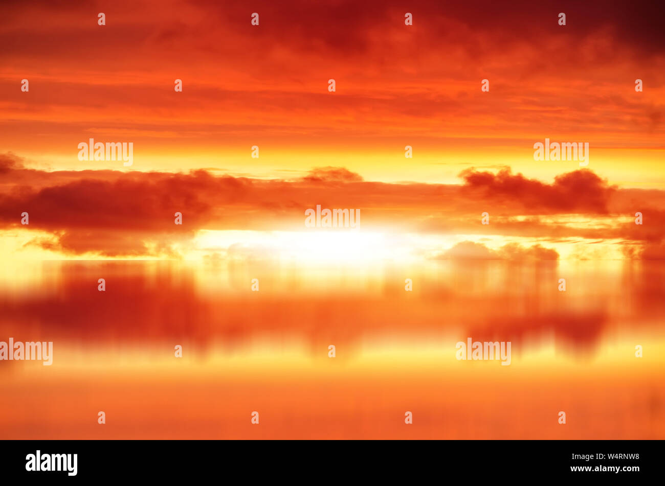 Red sunset over sea, rich dark clouds, Bright sun rays Stock Photo - Alamy