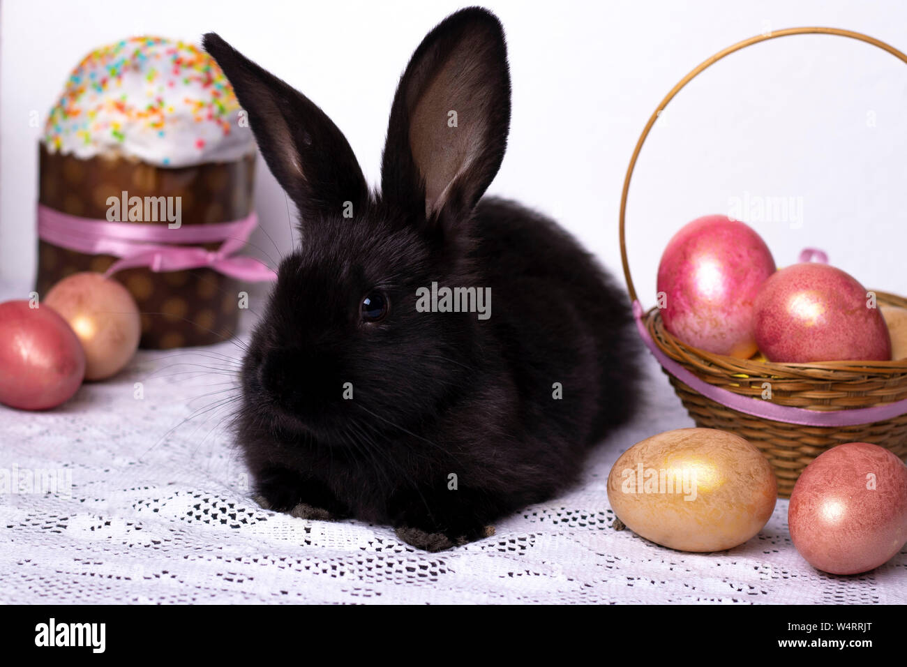 Little black rabbit in the Easter composition with eggs and Easter ...