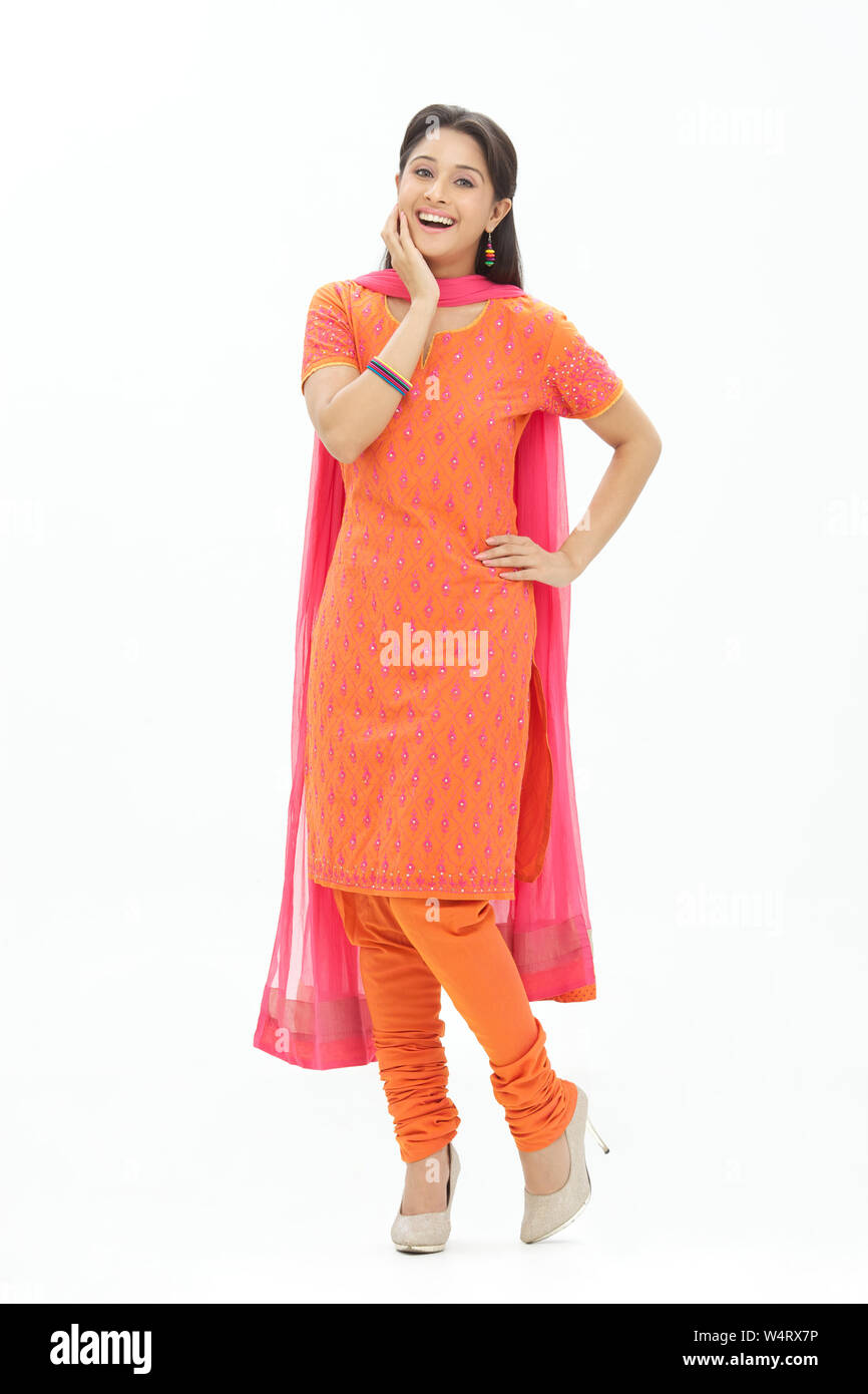 Woman smiling with hand on hip Stock Photo - Alamy