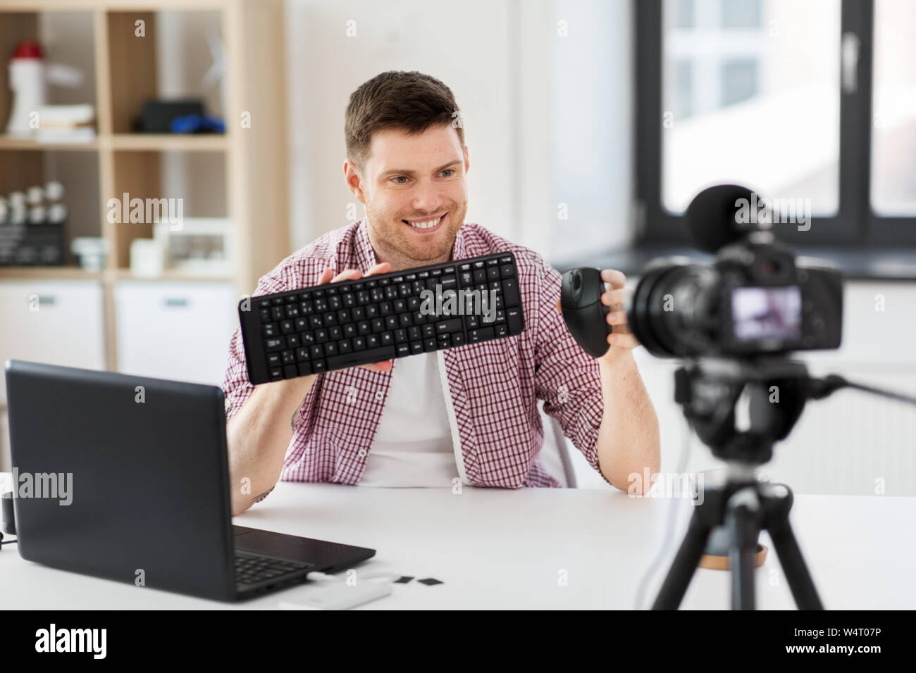 video blogger with keyboard and computer mouse Stock Photo