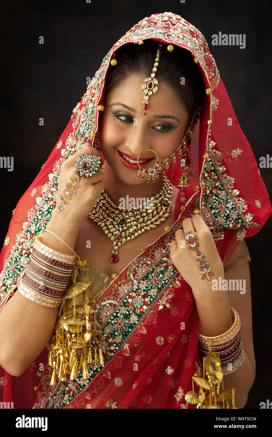 Punjabi bride smiling Stock Photo - Alamy