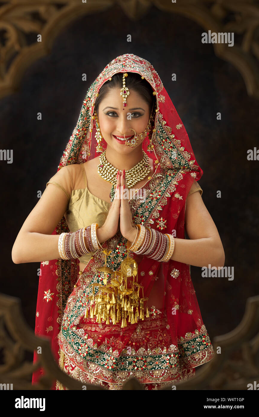 Portrait of an Punjabi bride welcoming with hands folded Stock Photo ...