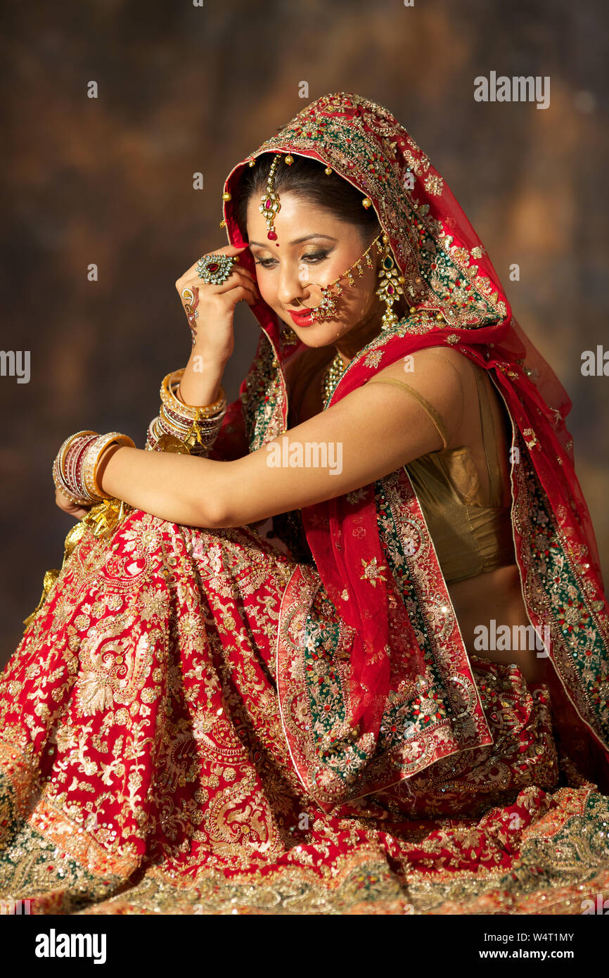 Punjabi bride sitting Stock Photo - Alamy