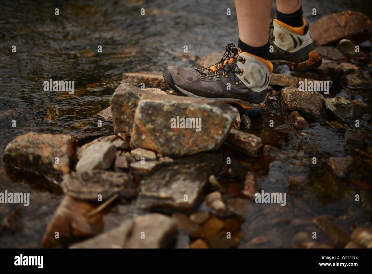 a person wearing hiking shoes standing 