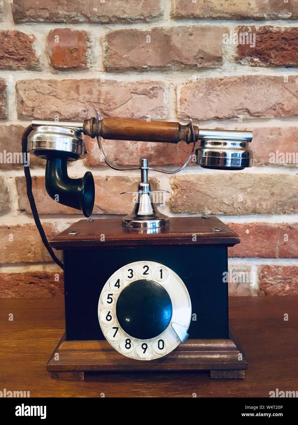 Old vintage phone on a table Stock Photo