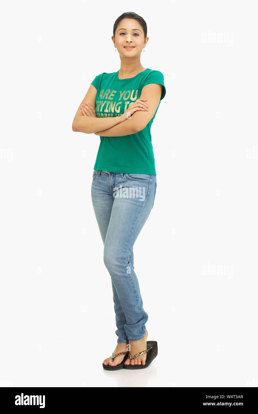 Woman standing with her arms crossed Stock Photo - Alamy