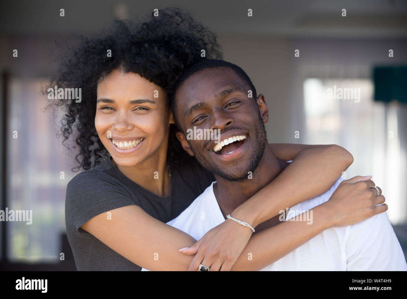 Headshot portrait happy african couple in love hugging outdoors Stock ...