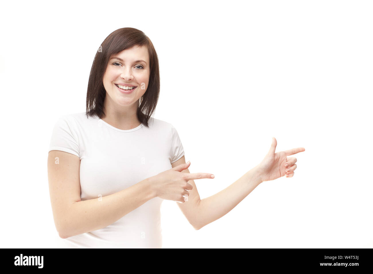 Girl in white t-shirt shows side isolated on white background Stock Photo