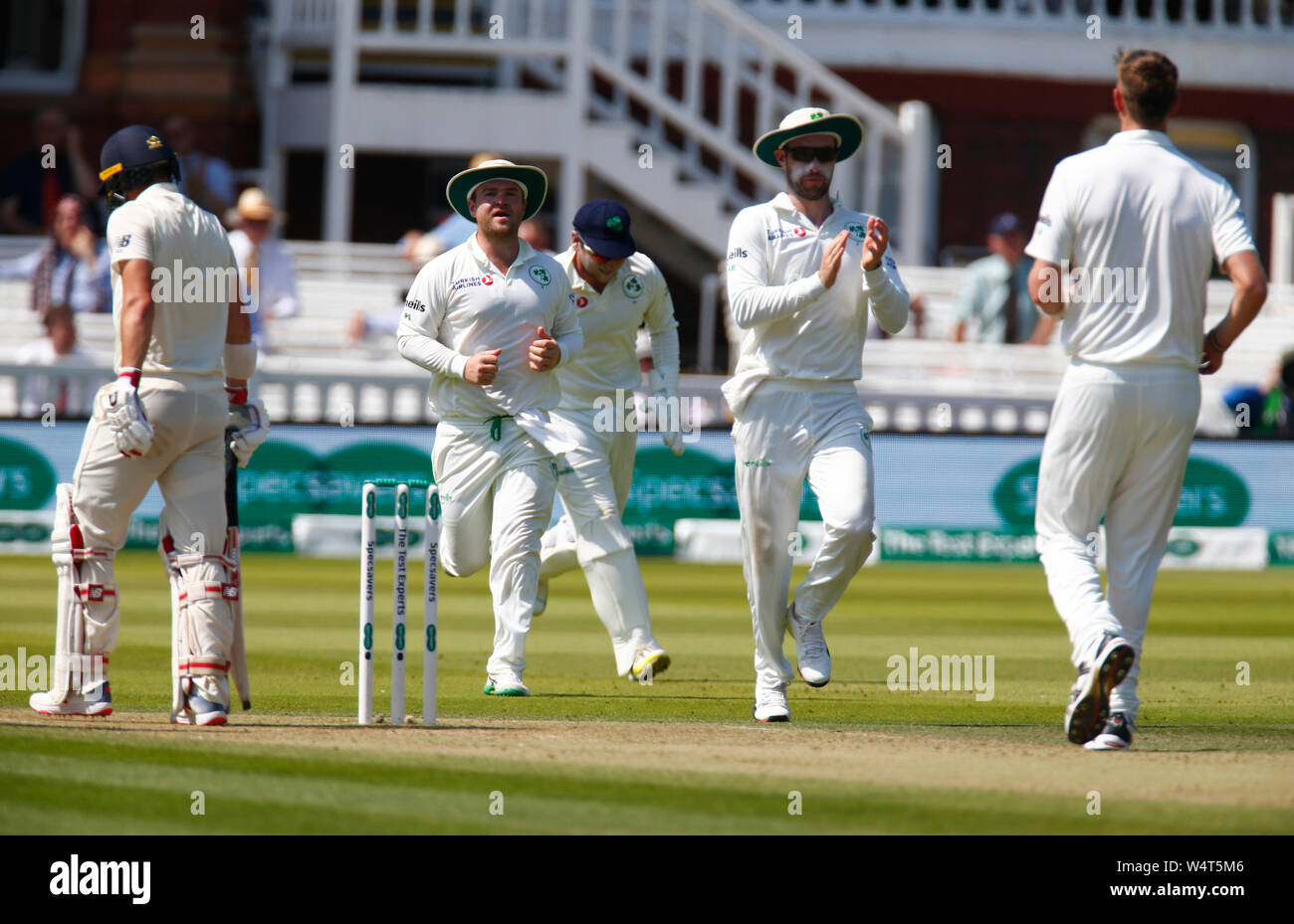 London, UK. 25th July, 2019. LONDON, ENGLAND. JULY 25: Boyd Rankin of Ireland celebrate the catch of Roy Burns of England by Gary Wilson of Ireland during International Test Match Series Day Two between England and Ireland at the Lord's Cricket Ground on July 25, 2019 in London, England. Credit: Action Foto Sport/Alamy Live News Stock Photo