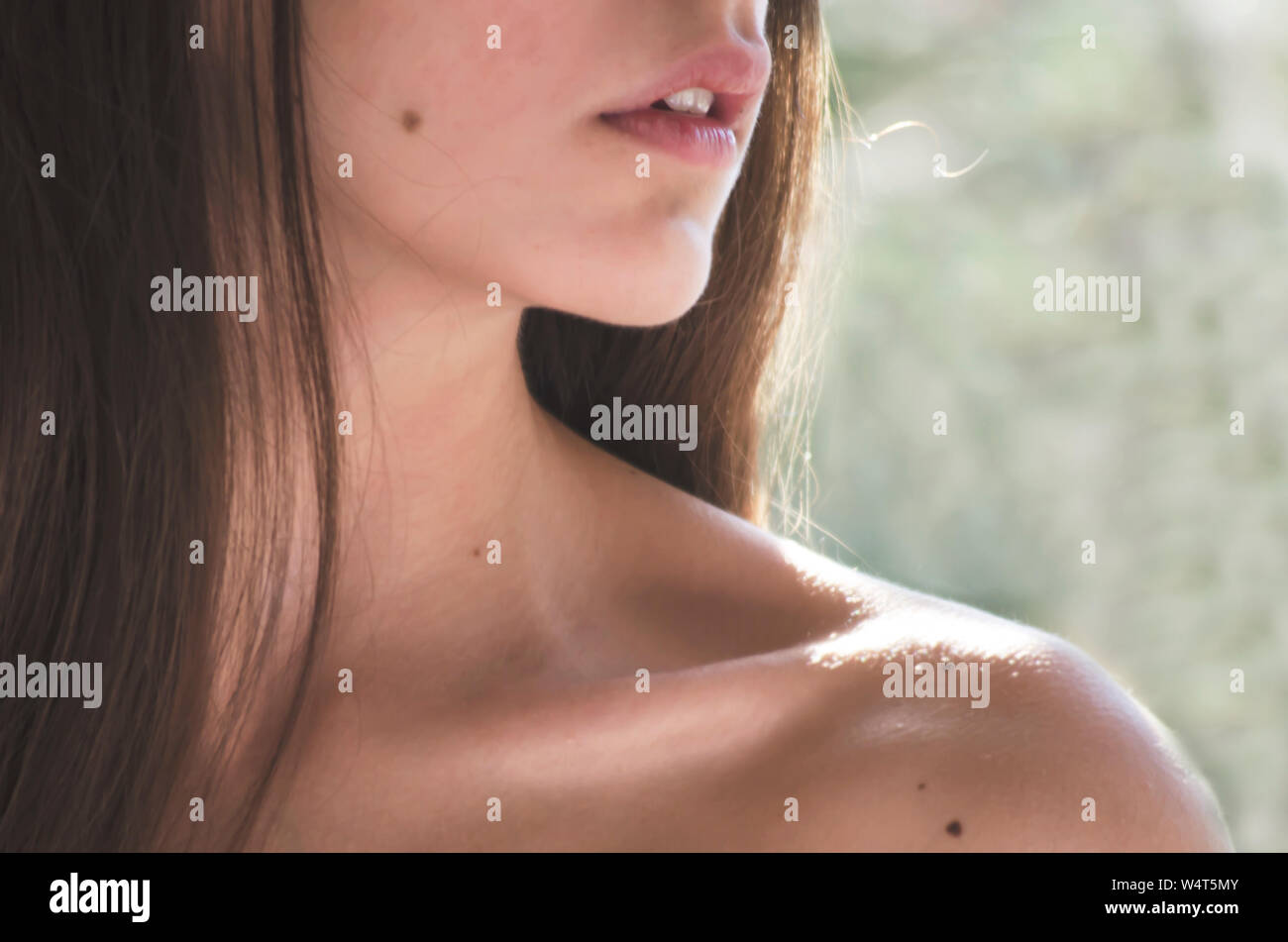 Close-up of a teenage girl's shoulder, neck and chin Stock Photo