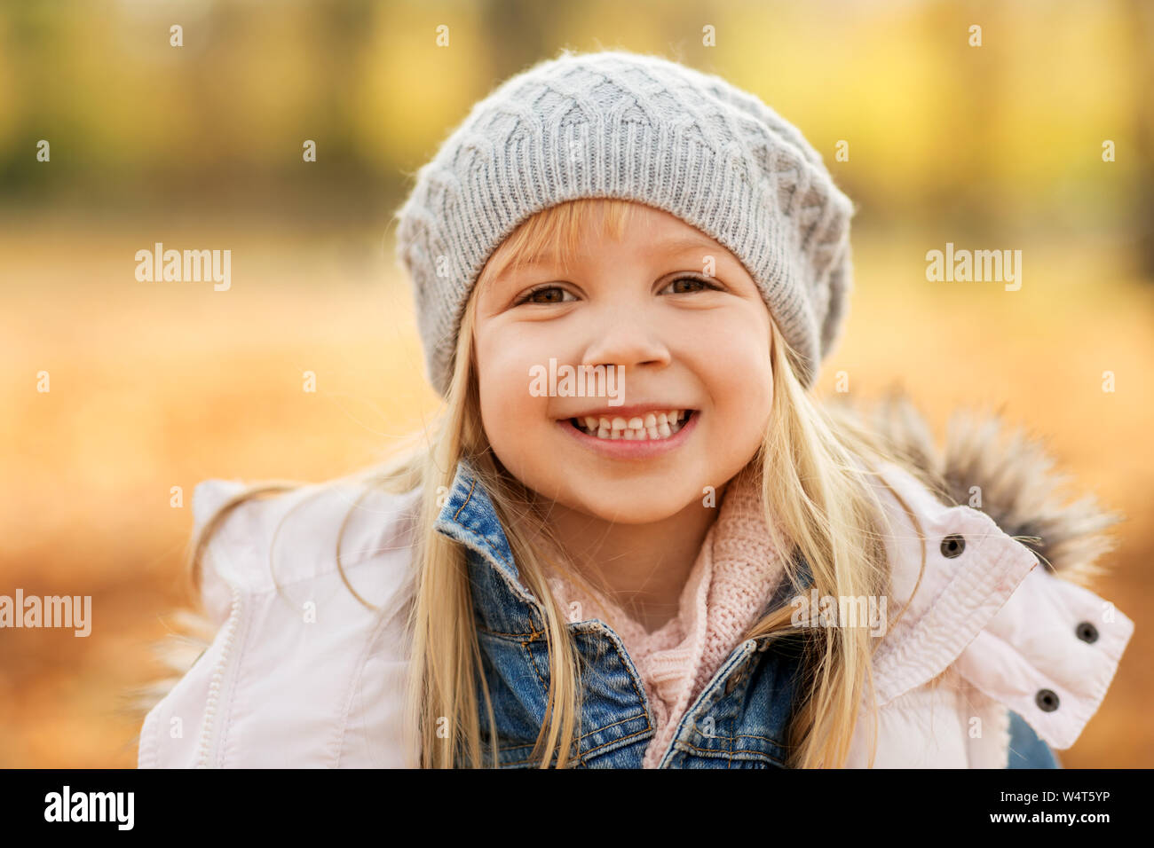 portrait of happy little girl at autumn park Stock Photo - Alamy