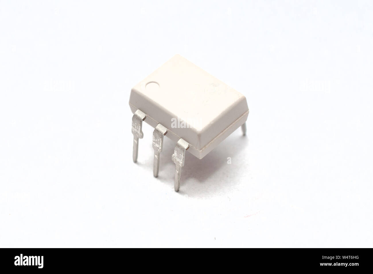 Optocoupler (or opto-isolator) electronic component on white background Stock Photo