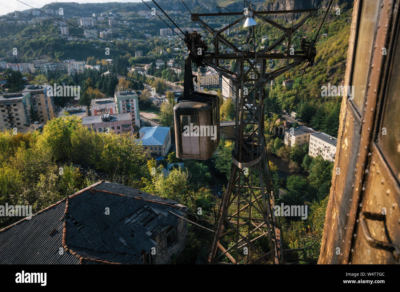 Derelict and rundown aerial old tram ropeway or cable car leading to the abandoned area in Chiatura. Industrial landmark of Georgia. Stock Photo