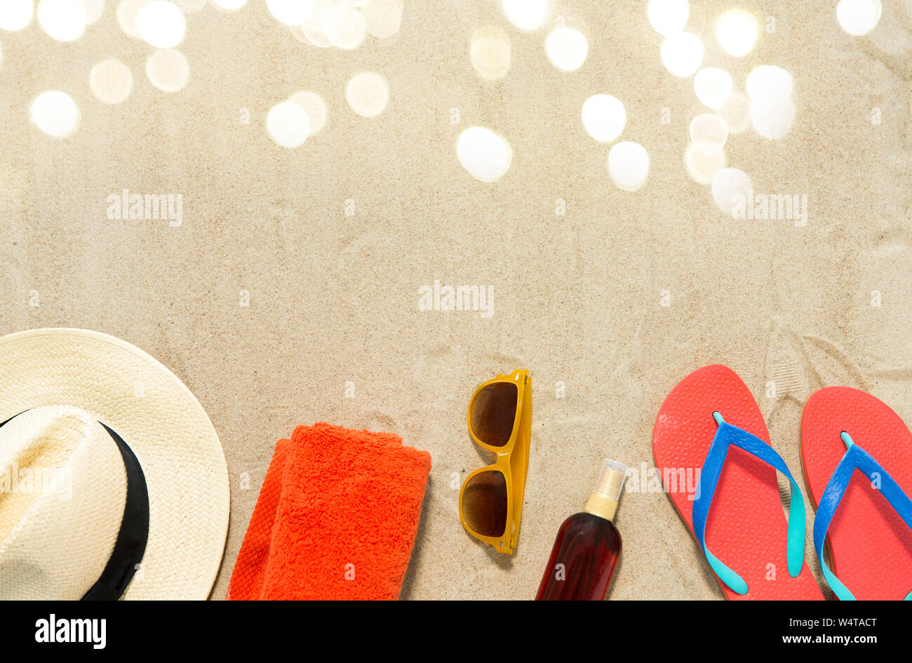 straw hat, flip flops and sunglasses on beach sand Stock Photo - Alamy