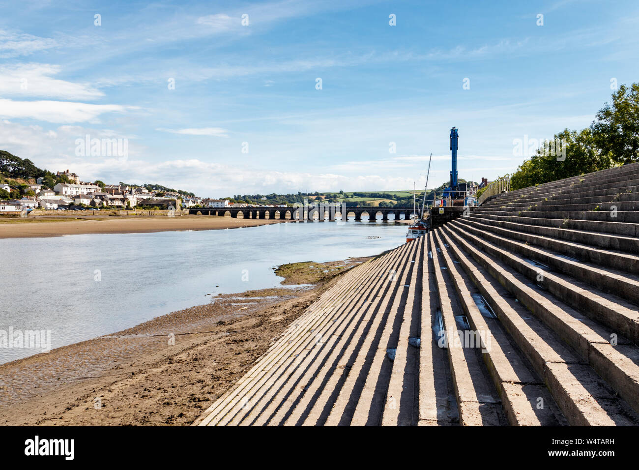 View upriver along the River Torridge to old Bideford Bridge from the steps of the Quay at low tide, Bideford, Devon, UK Stock Photo