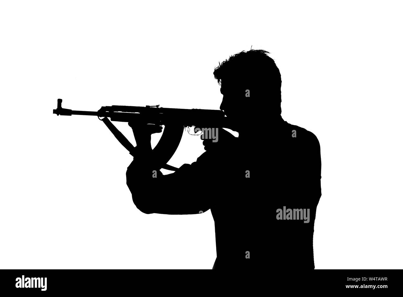 Army soldier/gangster  man shooting on studio isolated on white background Stock Photo